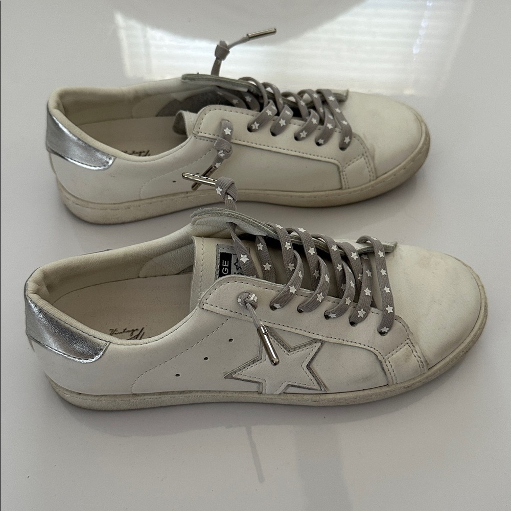White sneakers with star design